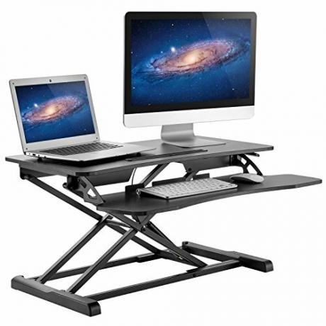 HUANUO Stående skrivebordshøydejusterbar - Sitte å stå opp Skrivebordkonverterer Gassfjærstigerør med tastaturbrett og monteringshull for gjennomføring for skjermstativ, LIFT-arbeidsstasjon Desktop fra 4,2 "til 20,1"