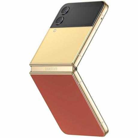 Geltonos, raudonos ir auksinės spalvos „Samsung Galaxy Z Flip 4“.